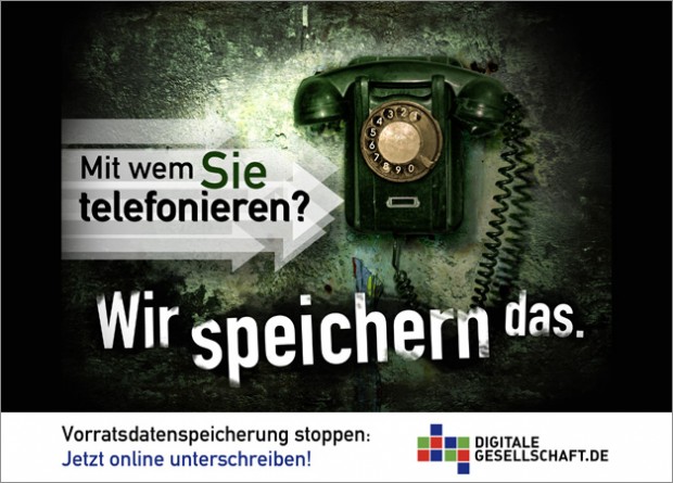 Old phone with a text in German, saying, that data about phone calls is retained